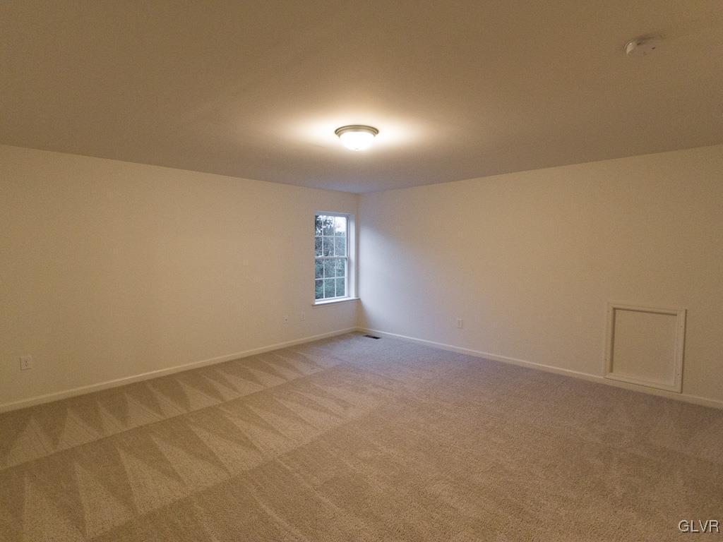 6559 Gun Club Road, Unit 35 Coopersburg, PA 18036 - Photo 42 of 48 an empty room with windows