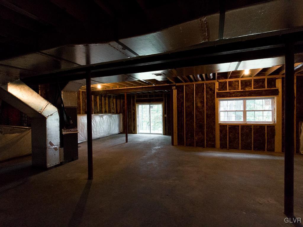 6559 Gun Club Road, Unit 35 Coopersburg, PA 18036 - Photo 45 of 48 a view of an empty room with a fireplace
