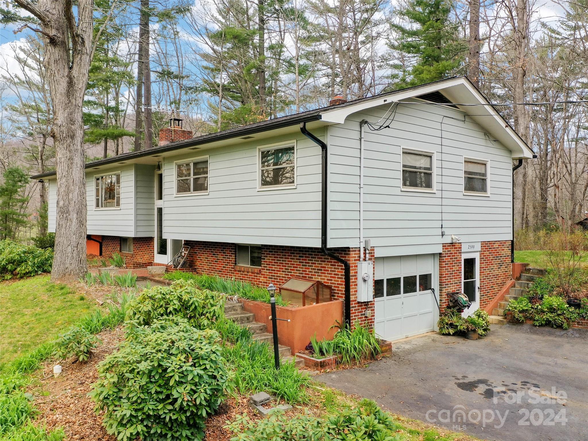 2599 Thickety Road Clyde, NC 28721 - Photo 1 of 30 front view of a house with a yard