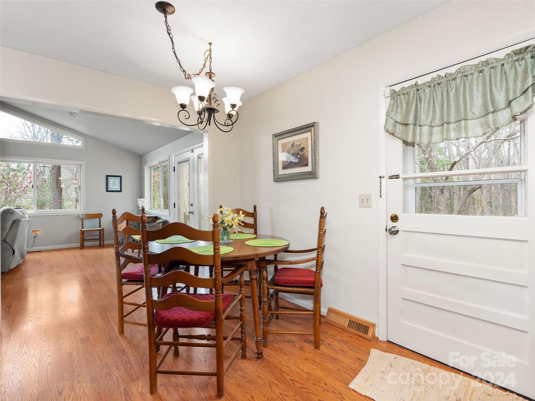 2599 Thickety Road Clyde, NC 28721 - Photo 11 of 30 a view of a dining room with furniture and wooden floor