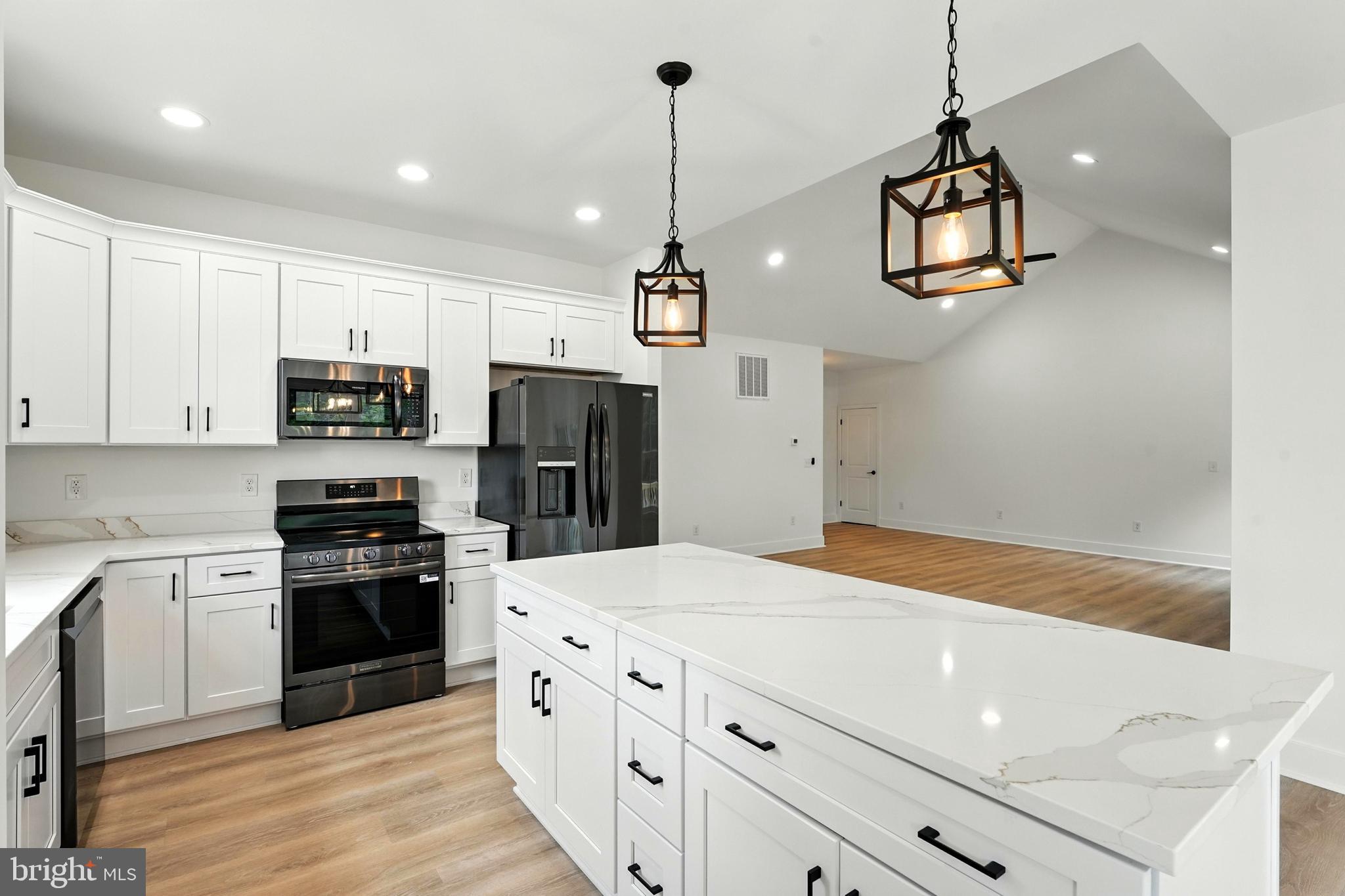 10446 Cherry Hill Road Culpeper, VA 22701 - Photo 13 of 53 a kitchen with stainless steel appliances a stove refrigerator and microwave
