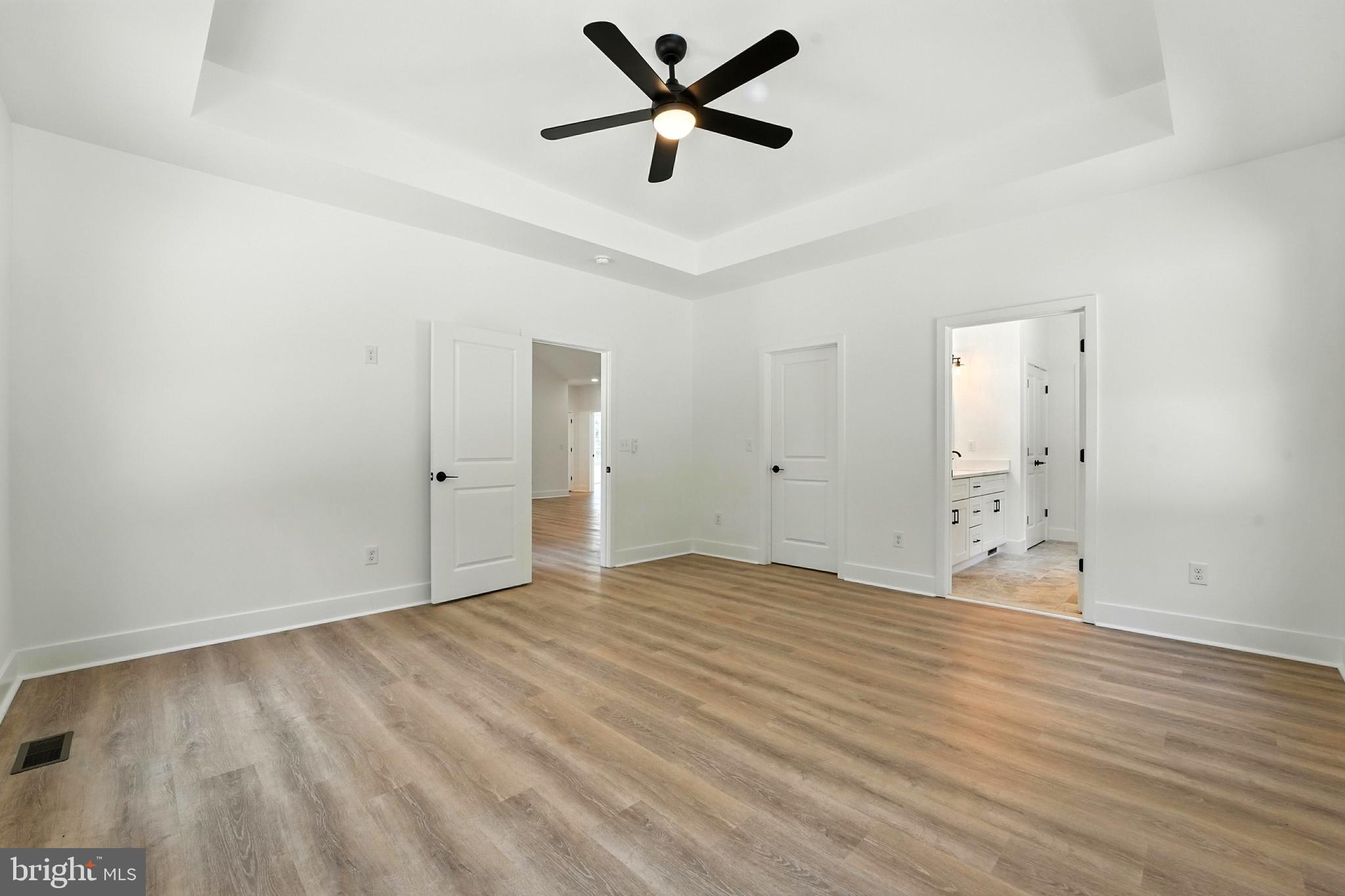 10446 Cherry Hill Road Culpeper, VA 22701 - Photo 21 of 53 an empty room with fan and a ceiling fan