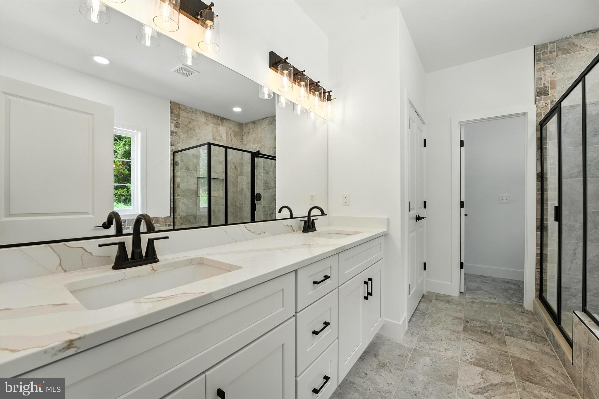 10446 Cherry Hill Road Culpeper, VA 22701 - Photo 23 of 53 a bathroom with a double vanity sink mirror and double