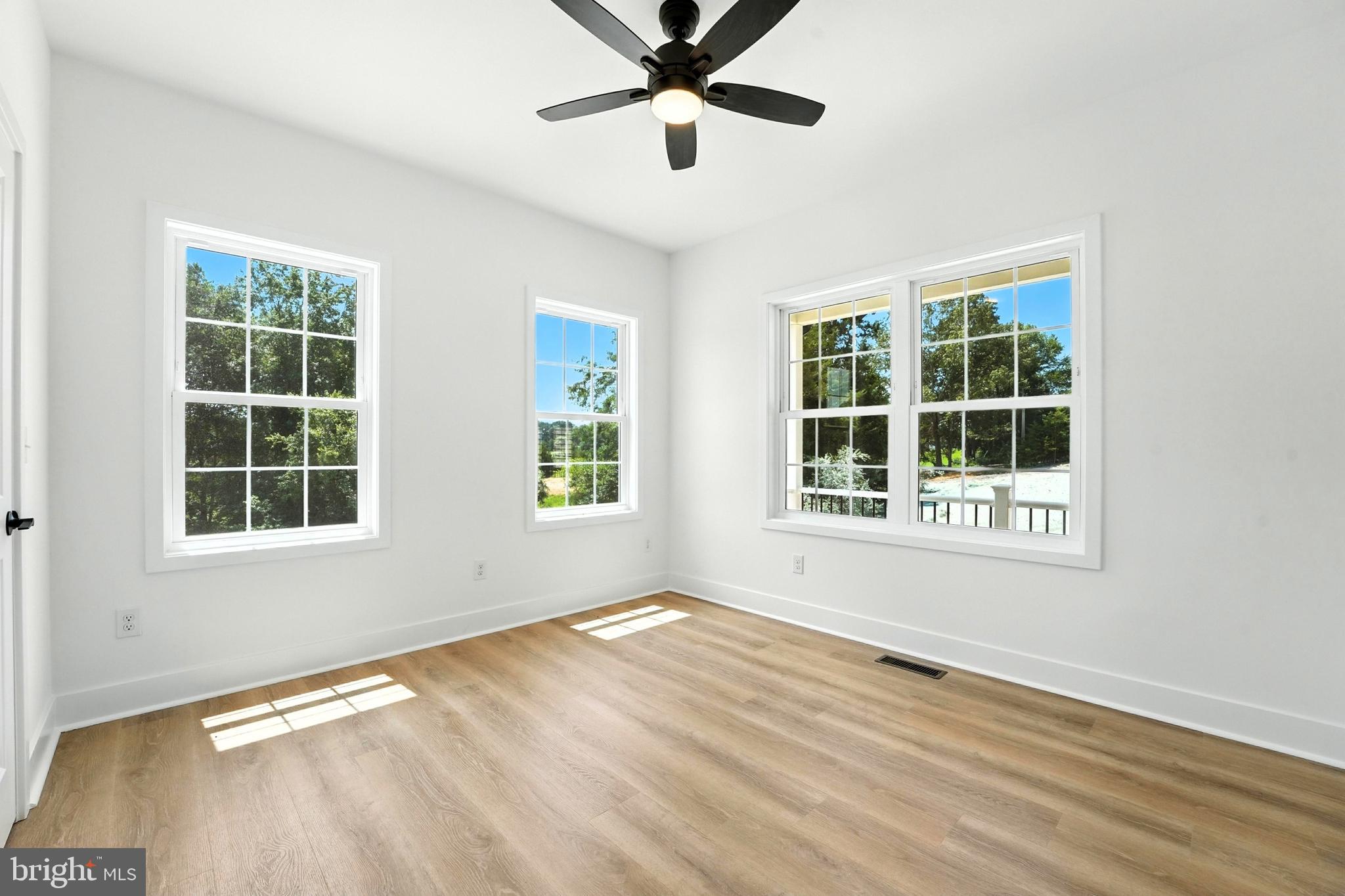 10446 Cherry Hill Road Culpeper, VA 22701 - Photo 27 of 53 an empty room with wooden floor and windows