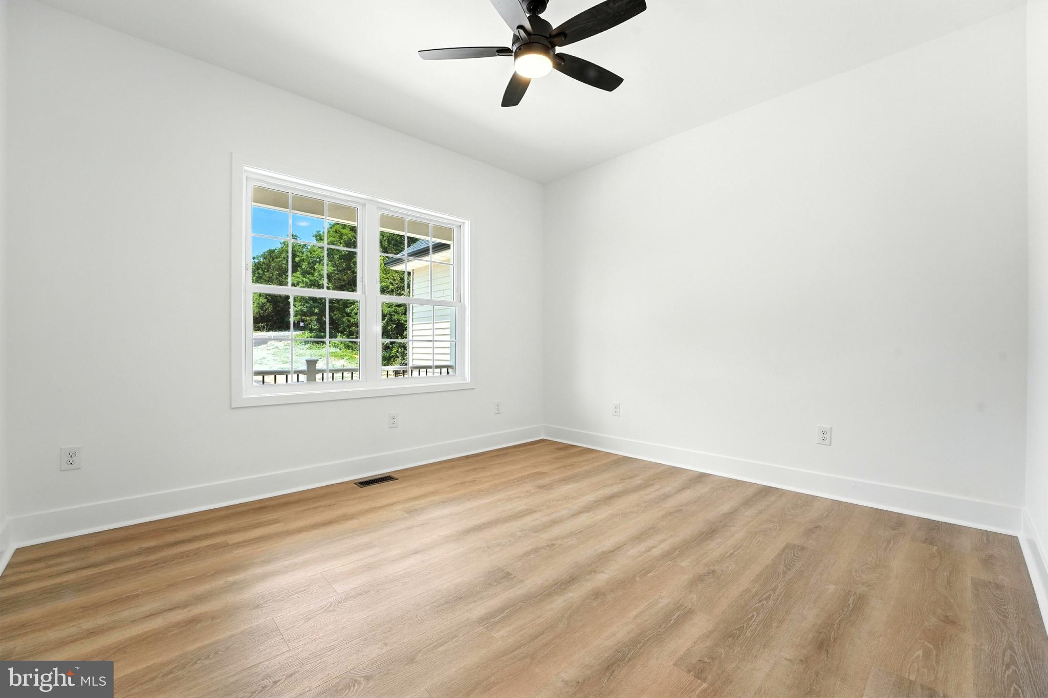 10446 Cherry Hill Road Culpeper, VA 22701 - Photo 30 of 53 an empty room with window and ceiling fan