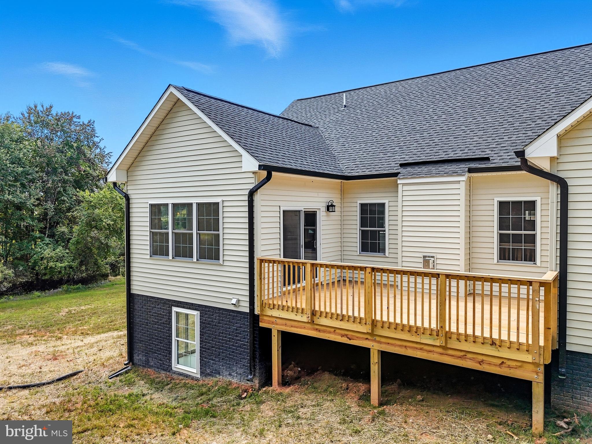10446 Cherry Hill Road Culpeper, VA 22701 - Photo 39 of 53 a view of a house with a wooden deck