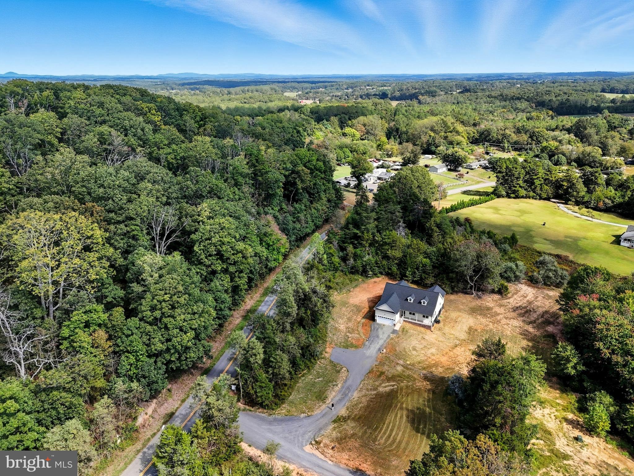 10446 Cherry Hill Road Culpeper, VA 22701 - Photo 45 of 53 an aerial view of residential houses with outdoor space and trees