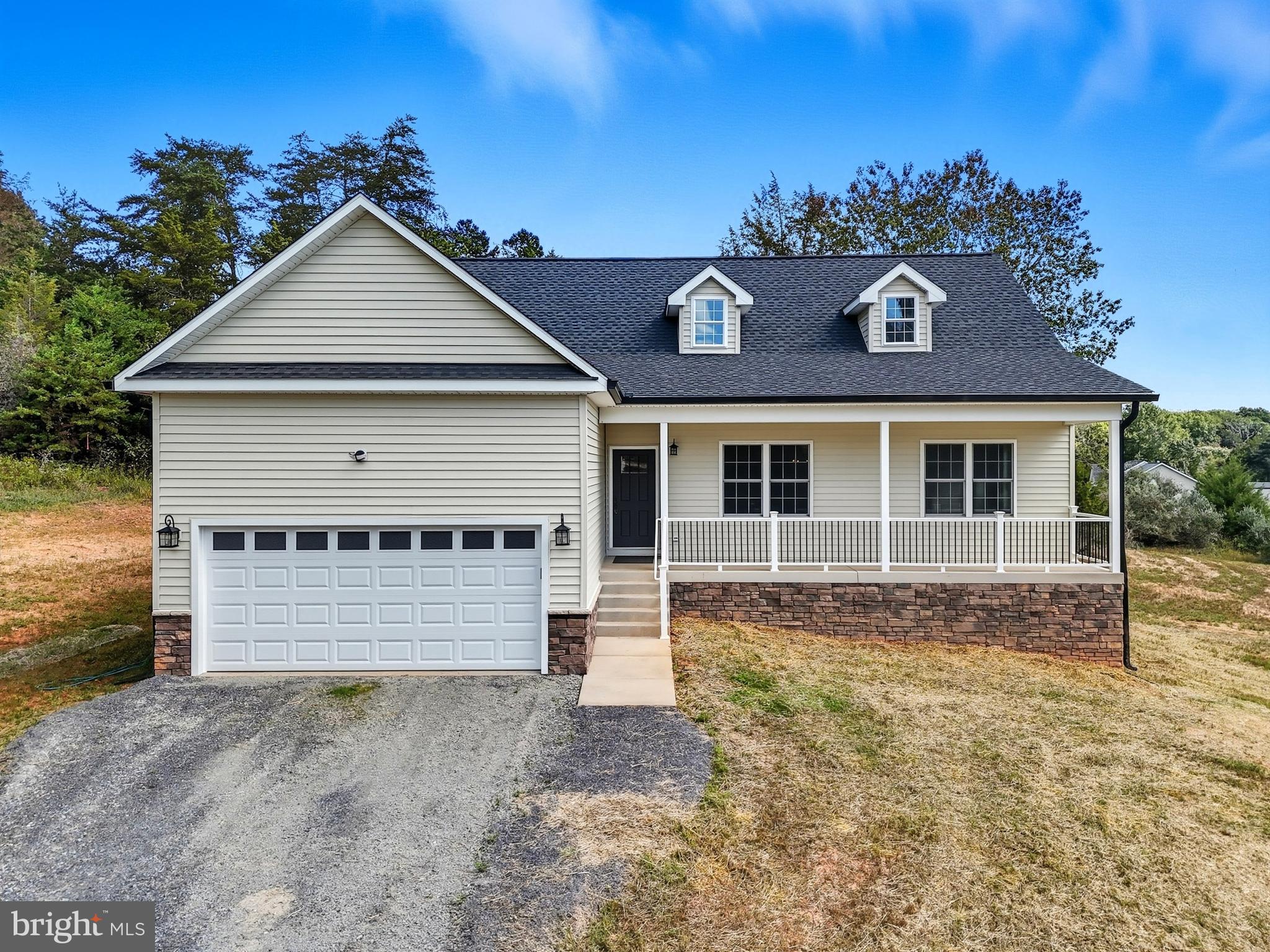 10446 Cherry Hill Road Culpeper, VA 22701 - Photo 47 of 53 a front view of a house with a yard and garage