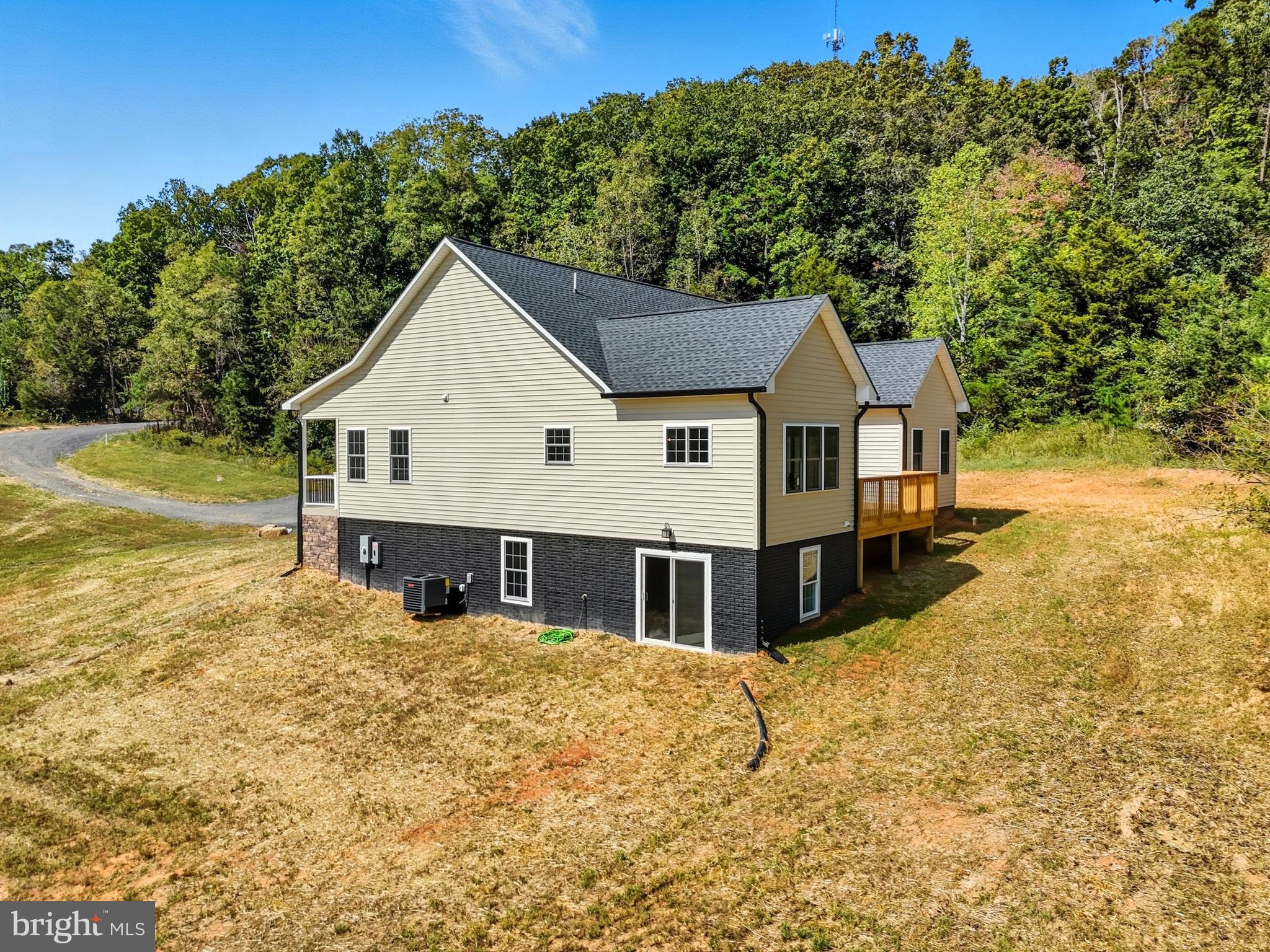10446 Cherry Hill Road Culpeper, VA 22701 - Photo 51 of 53 a view of a house with a yard covered with snow in the background