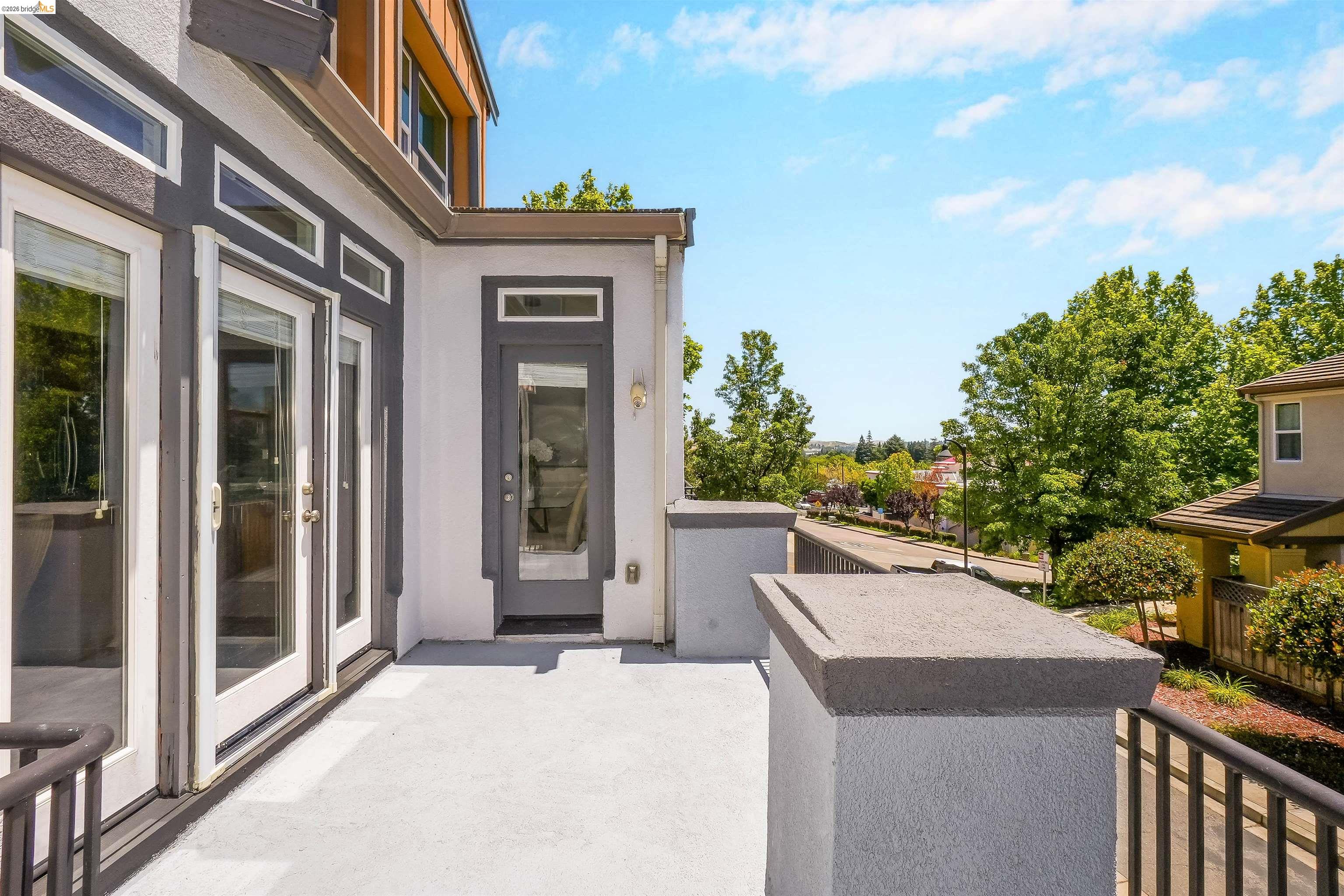 449 Constantine Court San Ramon, CA 94583 - Photo 30 of 63 Spacious outdoor deck featuring multiple glass-paned doors and a contemporary metal railing
