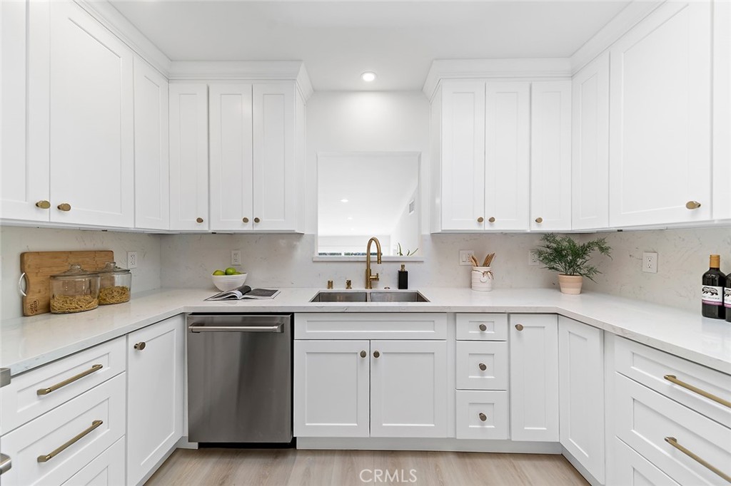 732 East Foothill Boulevard Glendora, CA 91741 - Photo 11 of 61 a kitchen with white cabinets and white appliances