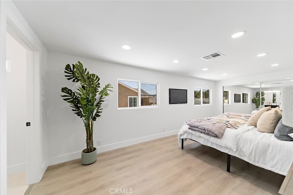 732 East Foothill Boulevard Glendora, CA 91741 - Photo 24 of 61 a bedroom with bed and a potted plant