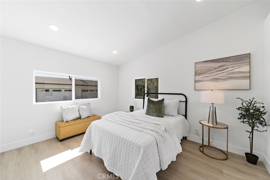 732 East Foothill Boulevard Glendora, CA 91741 - Photo 29 of 61 a bedroom with bed and a potted plant