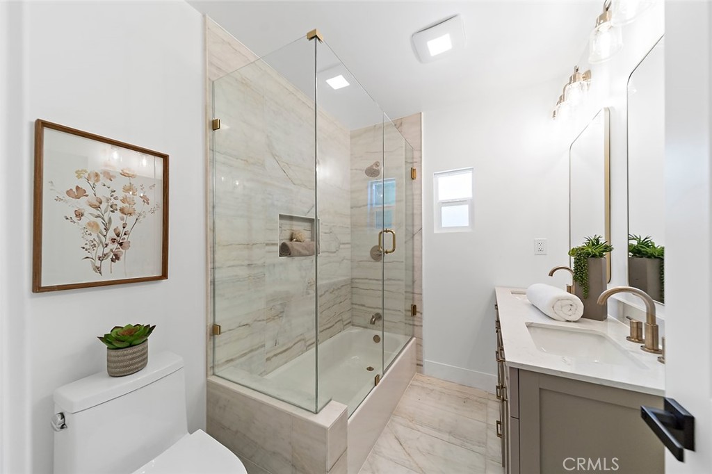 732 East Foothill Boulevard Glendora, CA 91741 - Photo 34 of 61 a bathroom with a granite countertop sink a toilet and shower