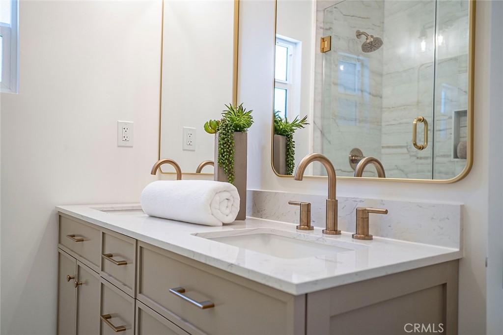 732 East Foothill Boulevard Glendora, CA 91741 - Photo 35 of 61 a bathroom with a sink and a mirror