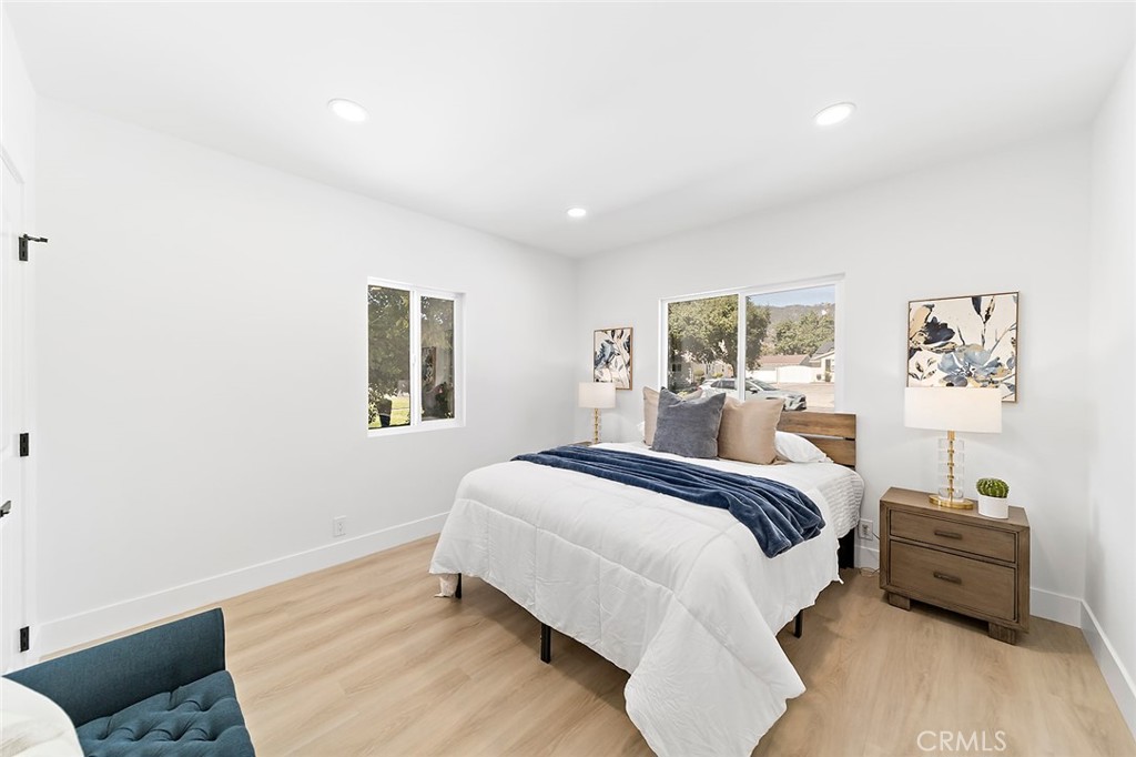 732 East Foothill Boulevard Glendora, CA 91741 - Photo 38 of 61 a spacious bedroom with a bed and wooden floor