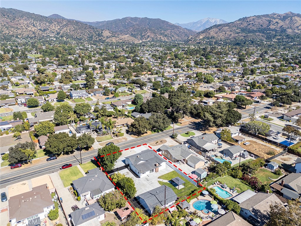 732 East Foothill Boulevard Glendora, CA 91741 - Photo 55 of 61 an aerial view of a city with lots of residential buildings and mountain view in back