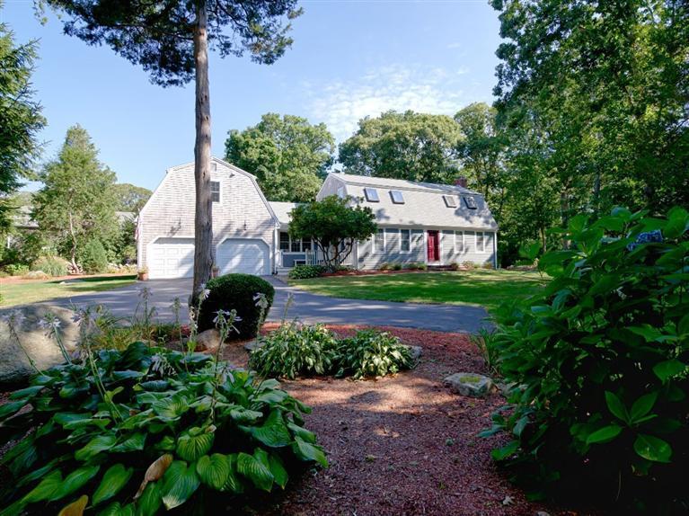 35 Quaker Road Falmouth, MA 02540 - Photo 2 of 22 a front view of a house with garden