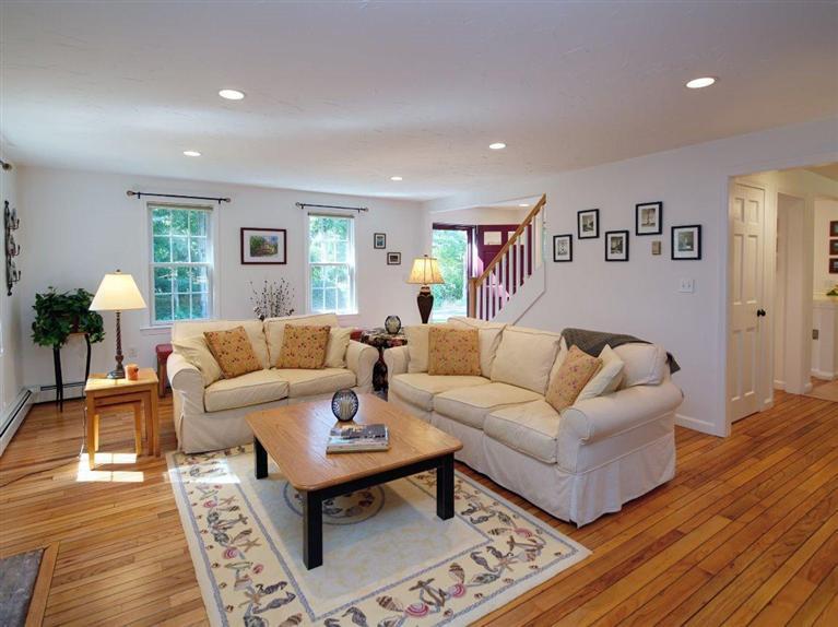 35 Quaker Road Falmouth, MA 02540 - Photo 5 of 22 a living room with furniture a lamp and wooden floor
