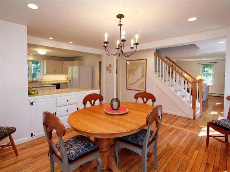 35 Quaker Road Falmouth, MA 02540 - Photo 7 of 22 a view of a dining room with furniture and wooden floor