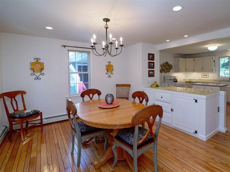 35 Quaker Road Falmouth, MA 02540 - Photo 8 of 22 a view of a dining room with furniture and wooden floor