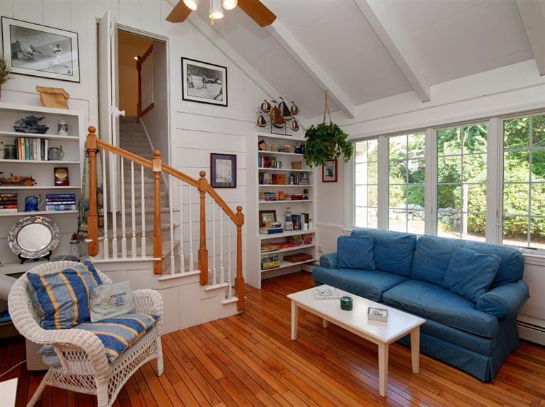 35 Quaker Road Falmouth, MA 02540 - Photo 9 of 22 a living room with furniture a bookshelf and a window