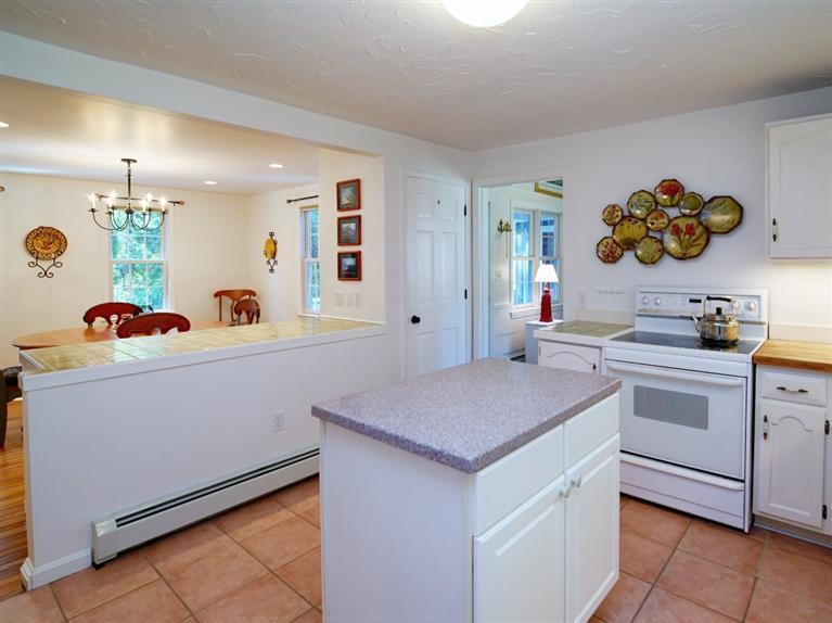 35 Quaker Road Falmouth, MA 02540 - Photo 10 of 22 a kitchen with a sink a stove and cabinets