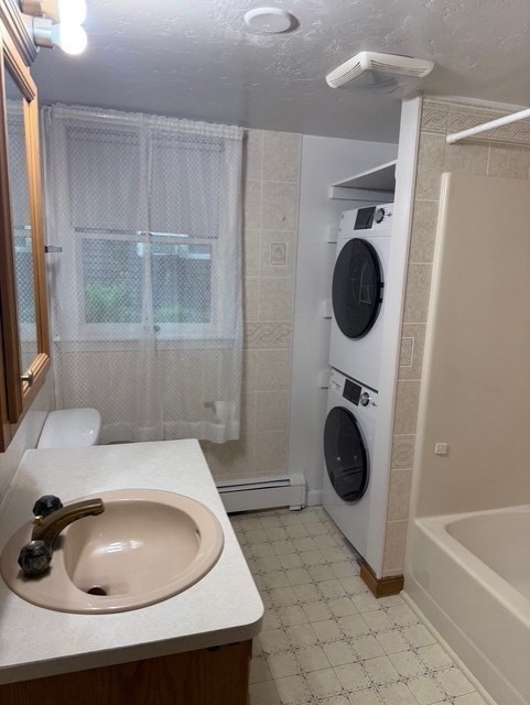 294 Pond Street, Unit 1 Braintree, MA 02184 - Photo 11 of 15 a bathroom with a sink a toilet and a mirror