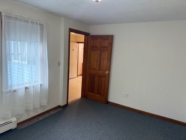 294 Pond Street, Unit 1 Braintree, MA 02184 - Photo 13 of 15 a view of an empty room and window