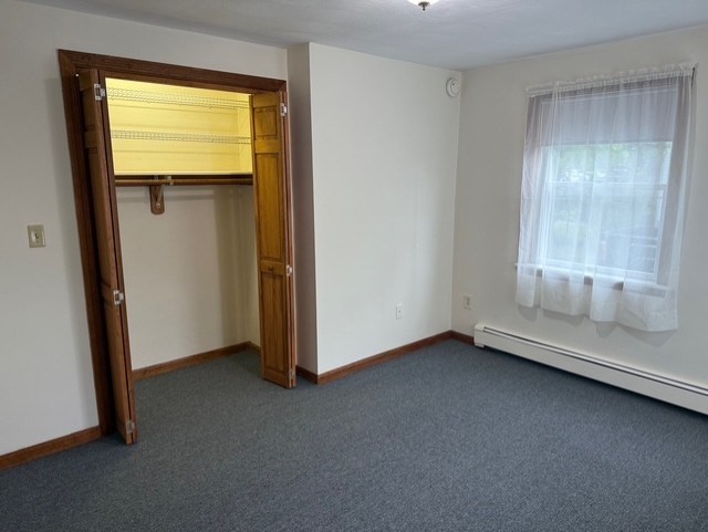 294 Pond Street, Unit 1 Braintree, MA 02184 - Photo 14 of 15 an empty room with window