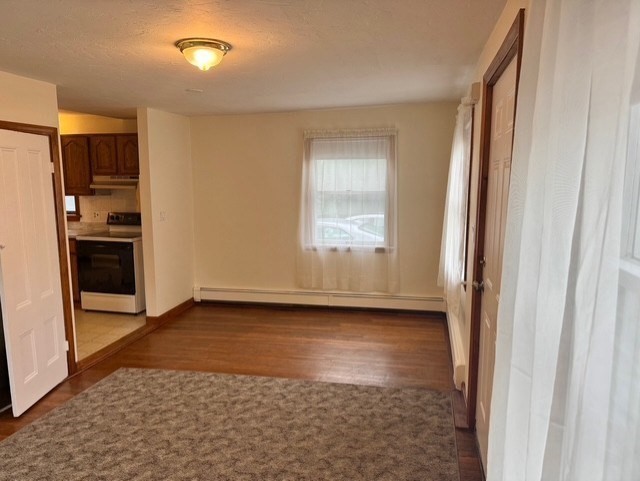 294 Pond Street, Unit 1 Braintree, MA 02184 - Photo 7 of 15 a view of a kitchen with a sink and a refrigerator
