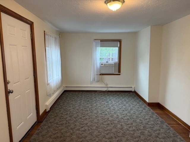 294 Pond Street, Unit 1 Braintree, MA 02184 - Photo 8 of 15 an empty room with window