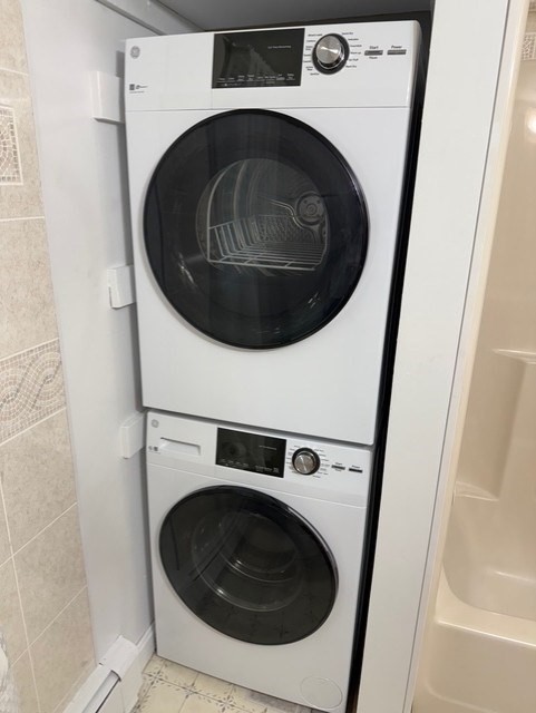 294 Pond Street, Unit 1 Braintree, MA 02184 - Photo 9 of 15 a utility room with dryer and washer