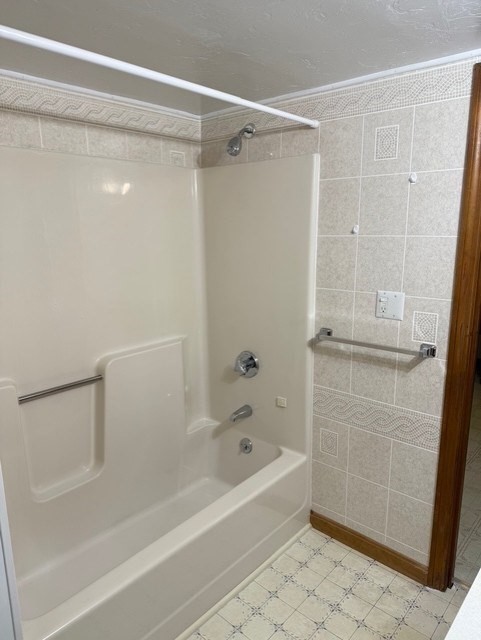 294 Pond Street, Unit 1 Braintree, MA 02184 - Photo 10 of 15 a bathroom with a shower and a bath tub