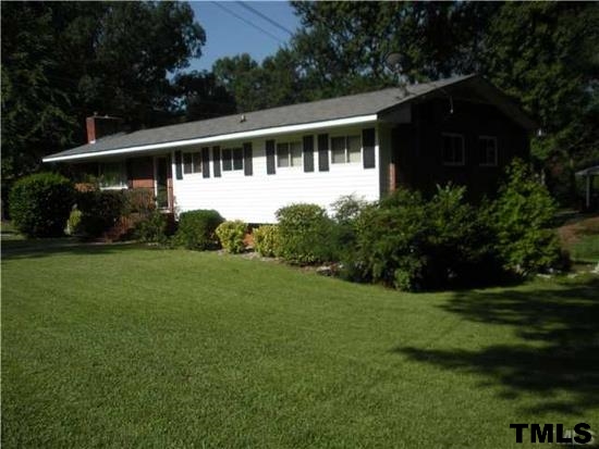 4408 Greenbrier Road Raleigh, NC 27603 - Photo 1 of 9 a view of a house with backyard and garden