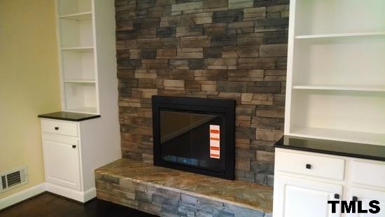 4408 Greenbrier Road Raleigh, NC 27603 - Photo 3 of 9 a room with a fireplace