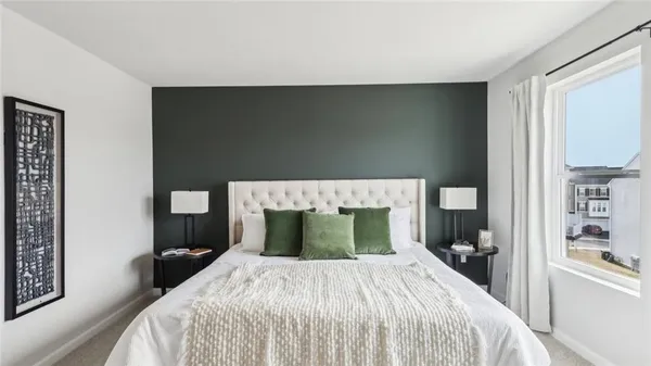 a bedroom with a bed and closet