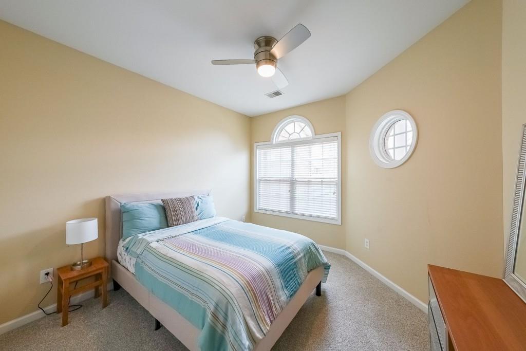 3916 Abbott Way Southwest, Unit 2 Powder Springs, GA 30127 - Photo 30 of 37 a bedroom with a bed and a window