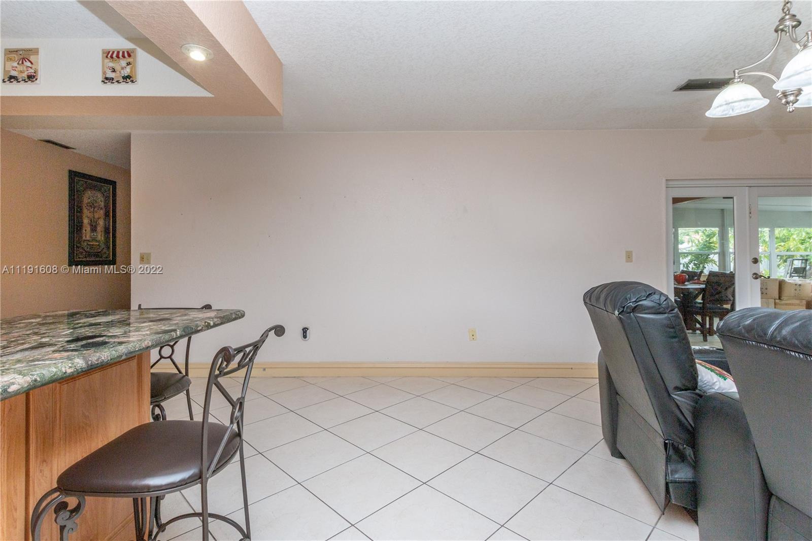 13560 Southwest 2nd Street Miami, FL 33184 - Photo 11 of 50 a view of a dining room with furniture