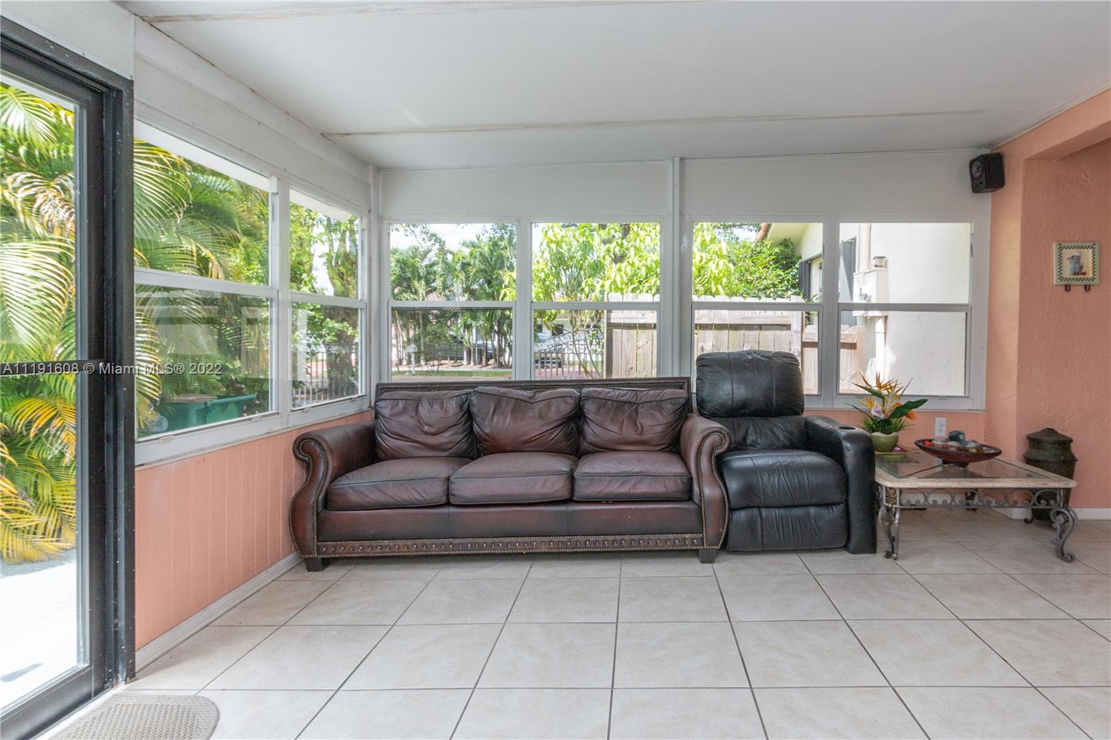 13560 Southwest 2nd Street Miami, FL 33184 - Photo 19 of 50 a living room with furniture and a large window