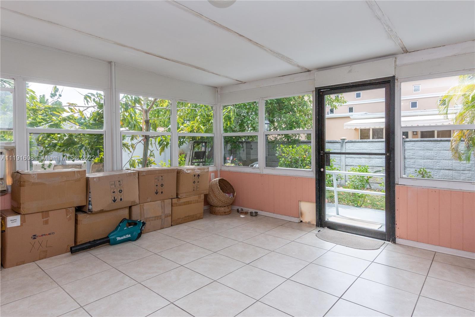 13560 Southwest 2nd Street Miami, FL 33184 - Photo 22 of 50 a view of workspace with furniture and large windows