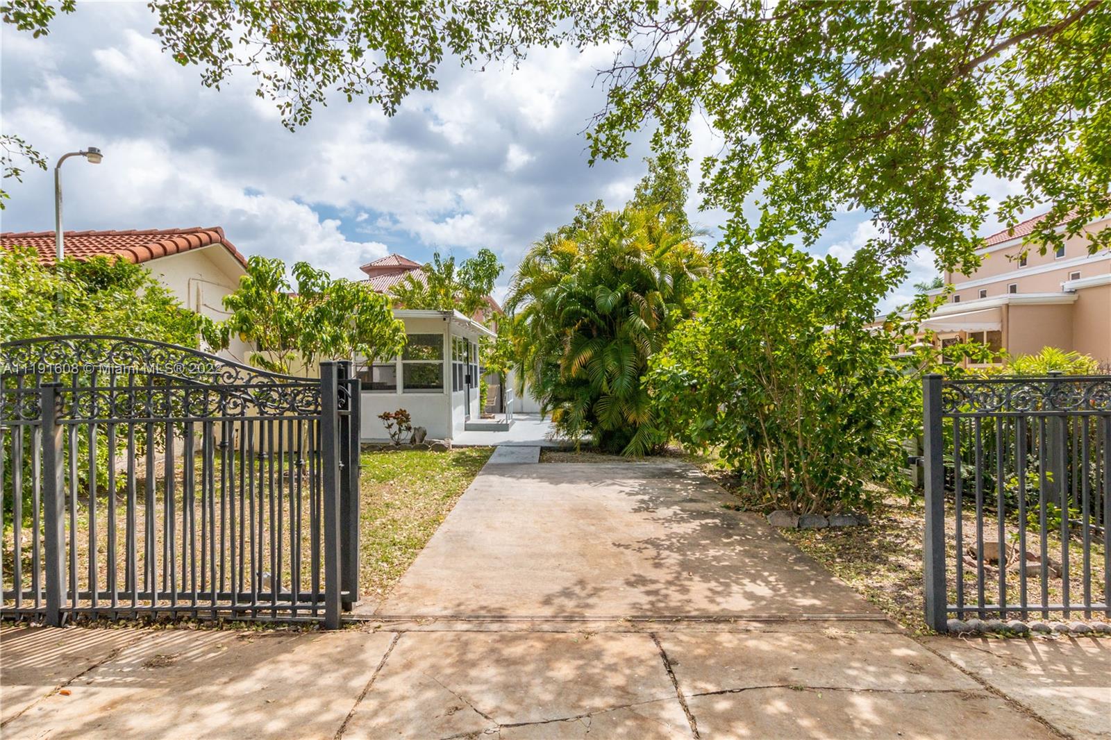 13560 Southwest 2nd Street Miami, FL 33184 - Photo 4 of 50 a view of a wrought iron fences in front of house