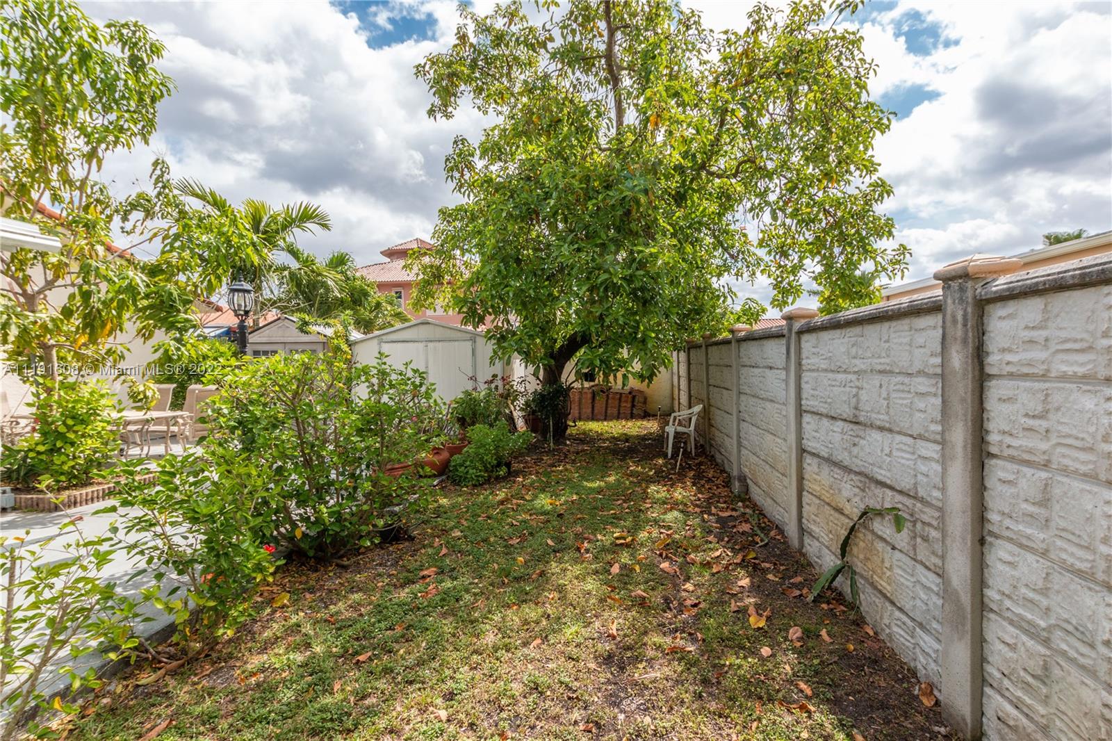 13560 Southwest 2nd Street Miami, FL 33184 - Photo 45 of 50 a view of a yard with plants and trees
