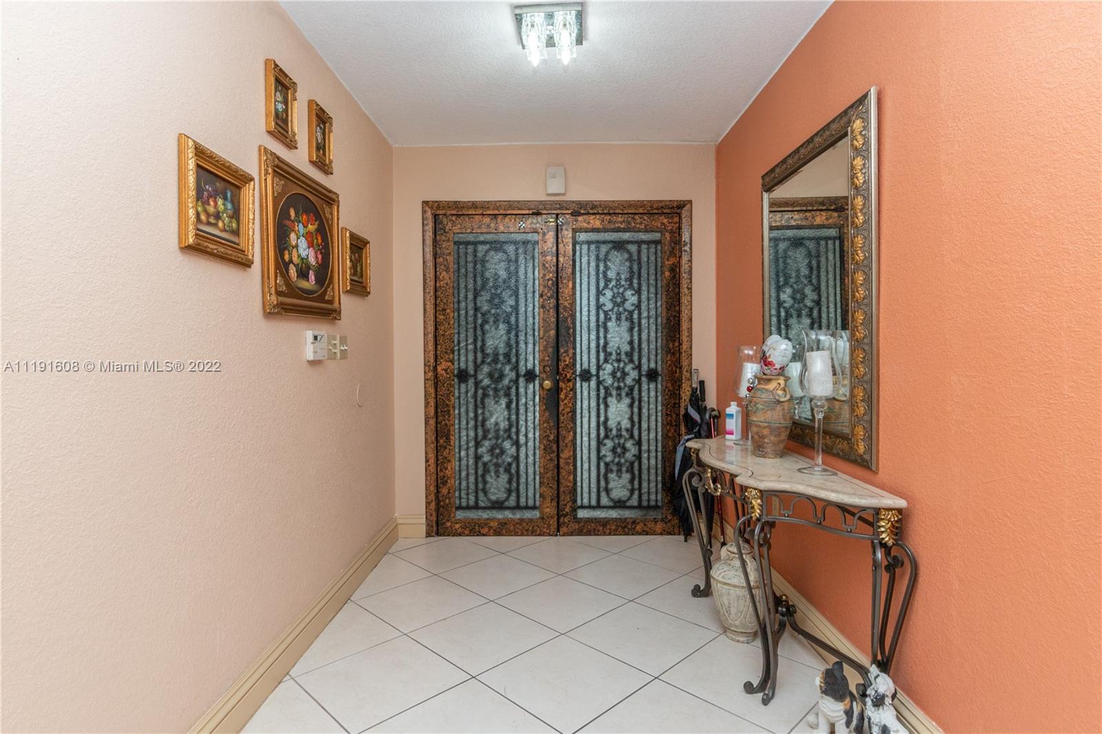 13560 Southwest 2nd Street Miami, FL 33184 - Photo 5 of 50 a view of a hallway with furniture and front door