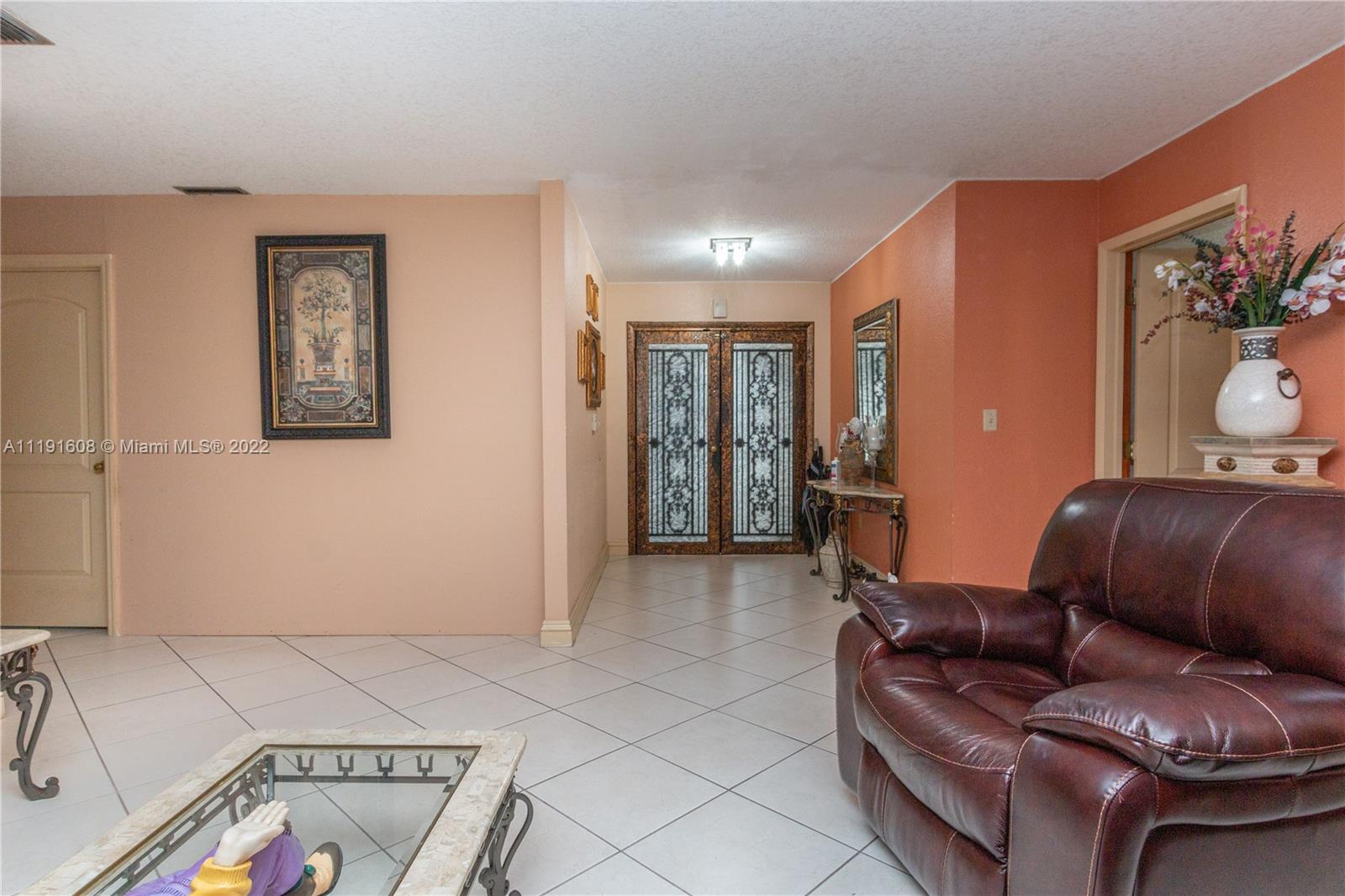 13560 Southwest 2nd Street Miami, FL 33184 - Photo 6 of 50 a living room with furniture and a couch