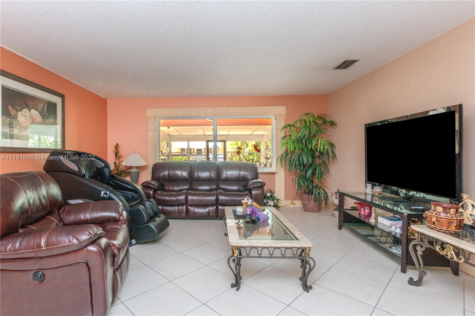 13560 Southwest 2nd Street Miami, FL 33184 - Photo 7 of 50 a living room with furniture and a flat screen tv