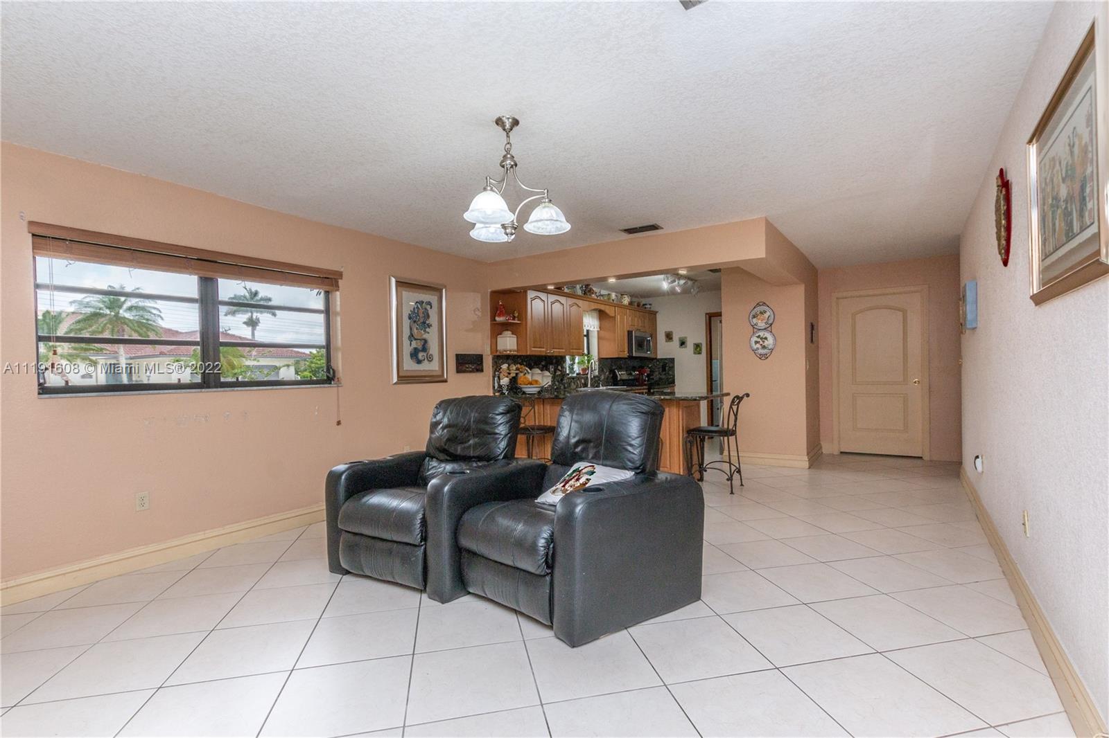 13560 Southwest 2nd Street Miami, FL 33184 - Photo 9 of 50 a living room with furniture and a window