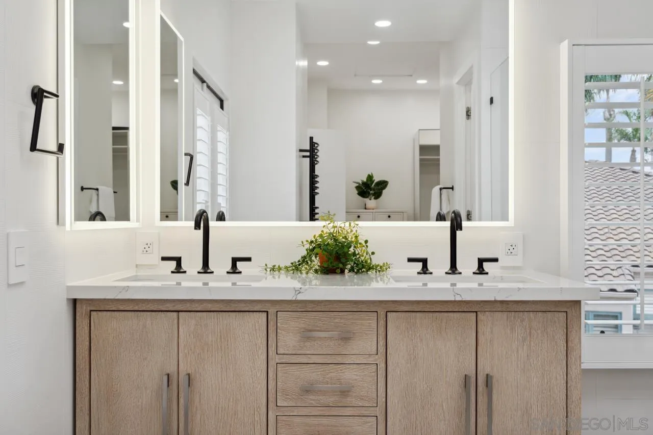 15345 Via Simpatico Rancho Santa Fe, CA 92091 - Photo 54 of 75 a bathroom with double vanity and a mirror
