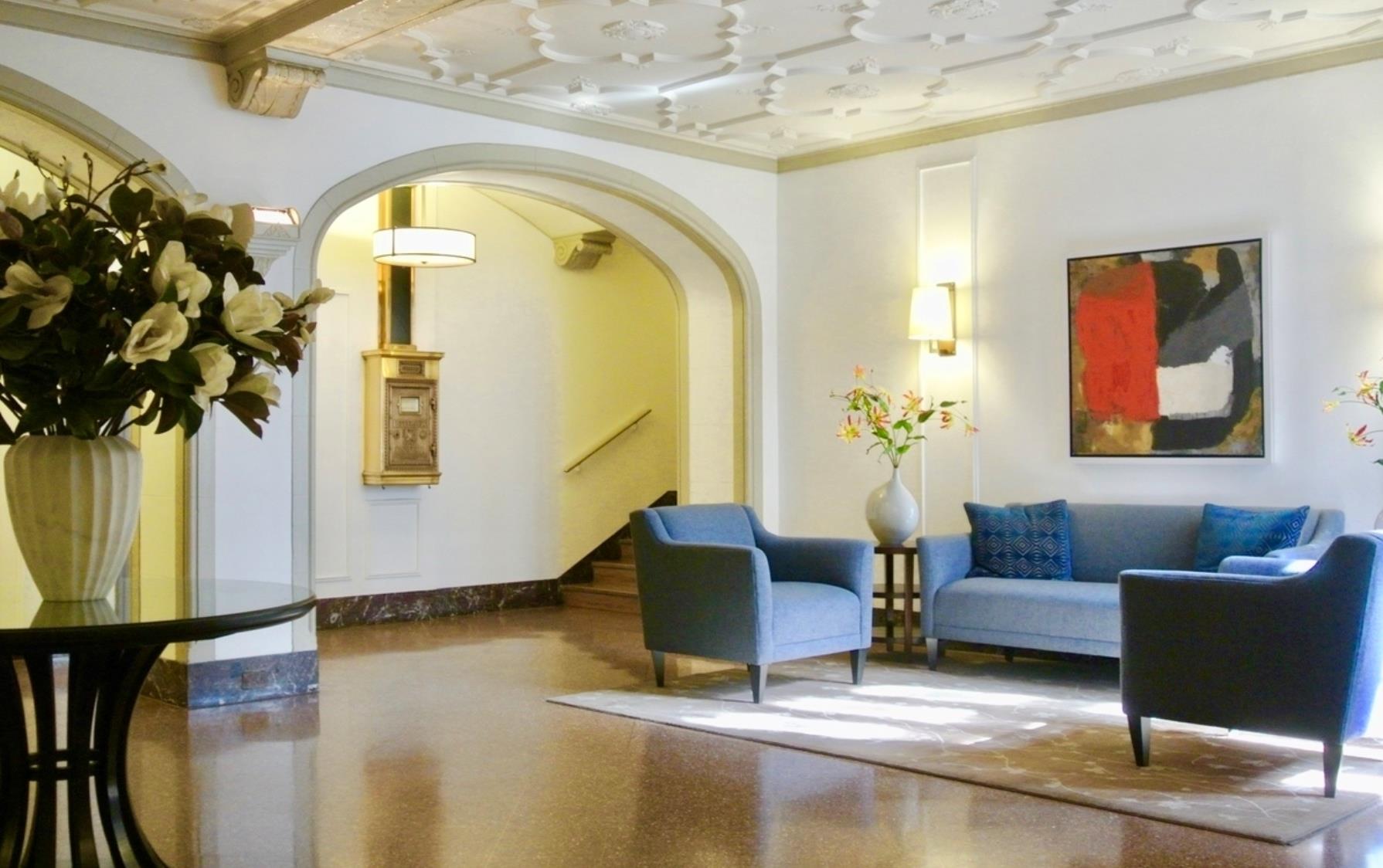 333 East 53rd Street, Unit 6B Manhattan, NY 10022 - Photo 8 of 15 a living room with furniture and a large window