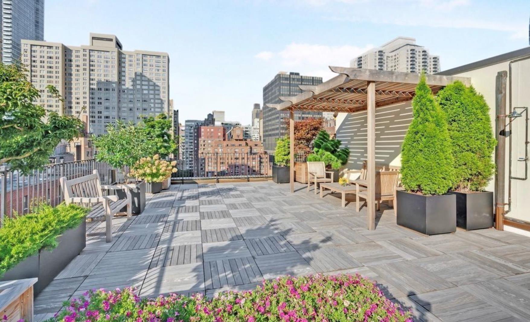 333 East 53rd Street, Unit 6B Manhattan, NY 10022 - Photo 9 of 15 a view of a building with potted plants
